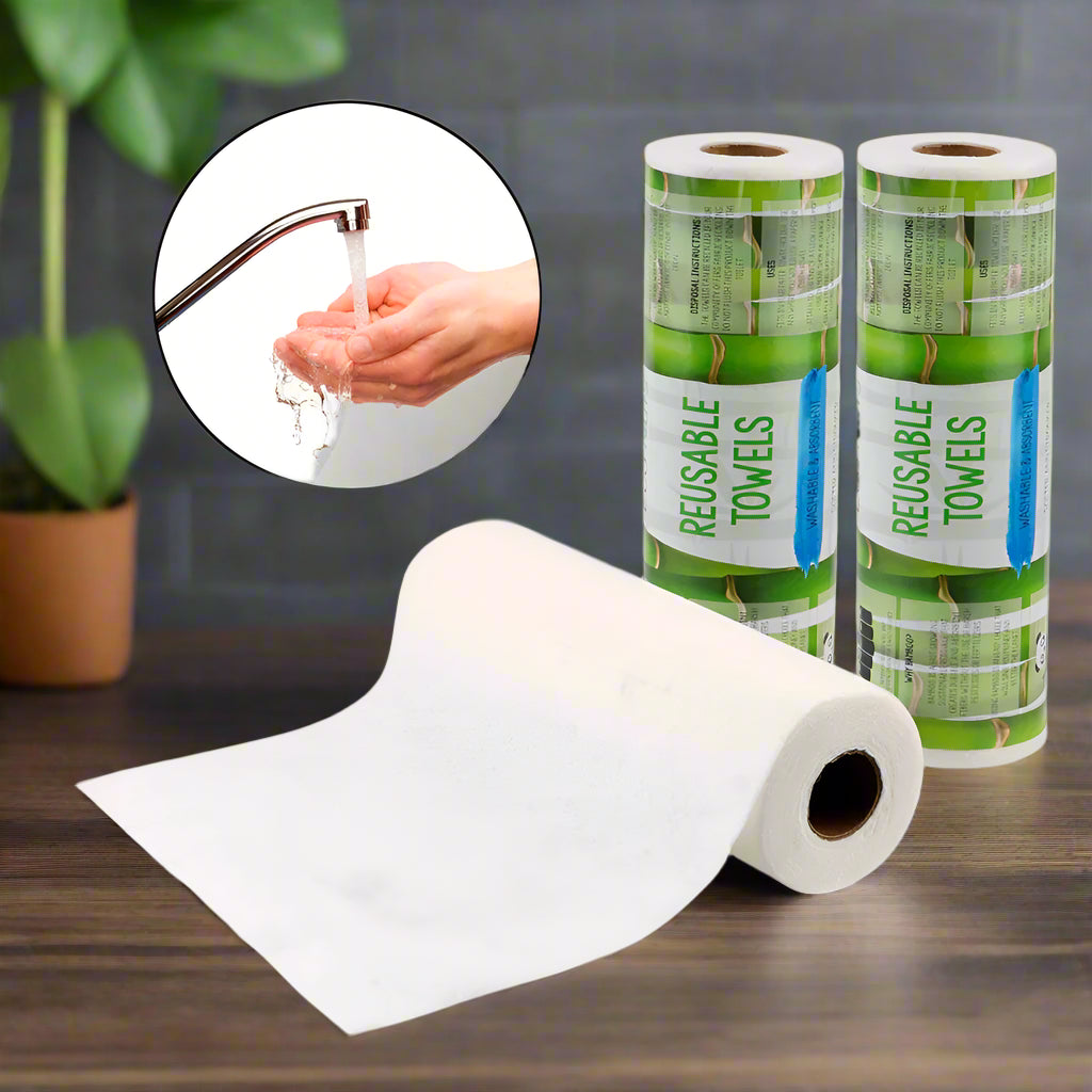 EcoNest Kitchen's roll of 25 reusable bamboo cleaning cloths next to a kitchen sink with soapy dishes