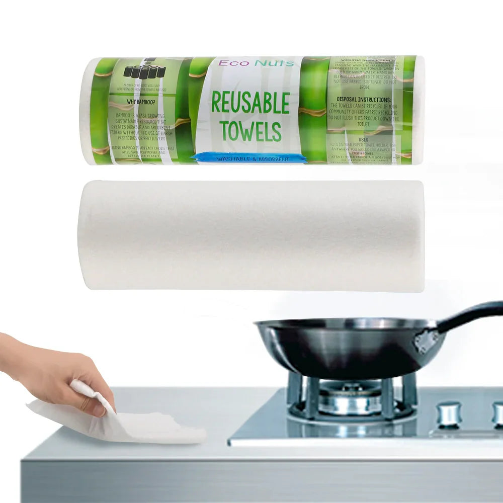 EcoNest Kitchen's roll of 25 reusable bamboo cleaning cloths next to a kitchen sink with soapy dishes