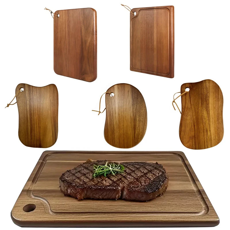 Set of wooden cutting boards with a steak on one board.