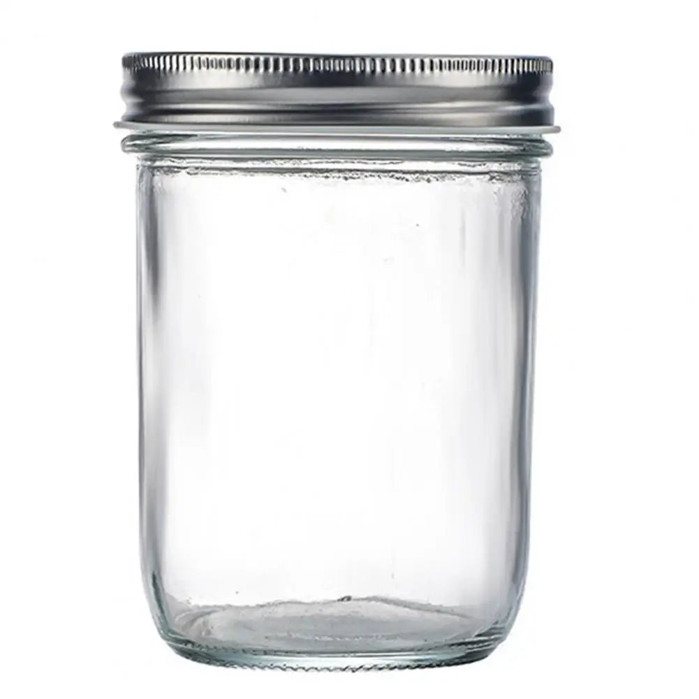 Clear glass jar with a metal lid on a white background