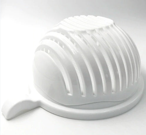 White kitchen tool with a textured surface on a light gray background