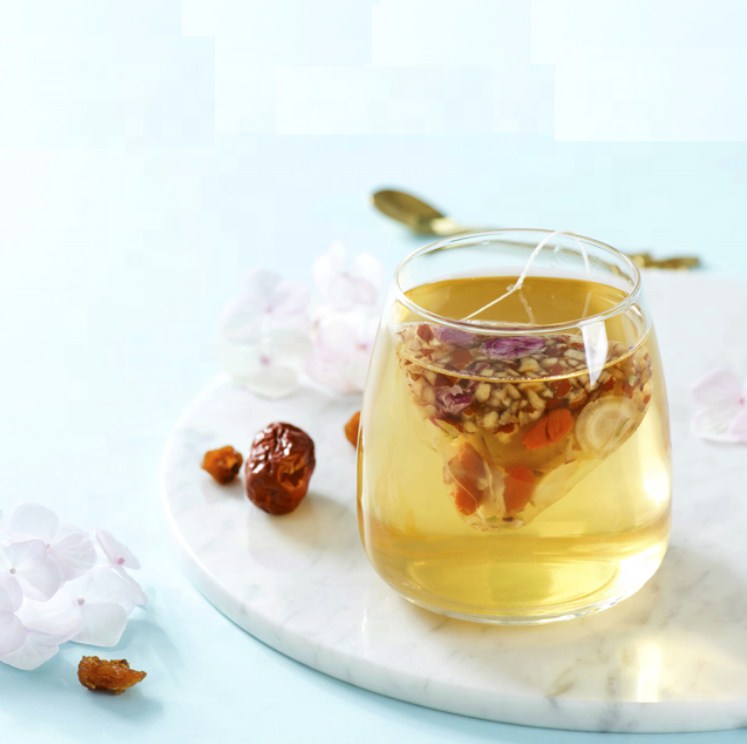 EcoNest Kitchen's Natural Warming Womb Detox Tea by Yogi, featuring herbal ingredients for women's health and a calming experience, presented in a beautiful package.