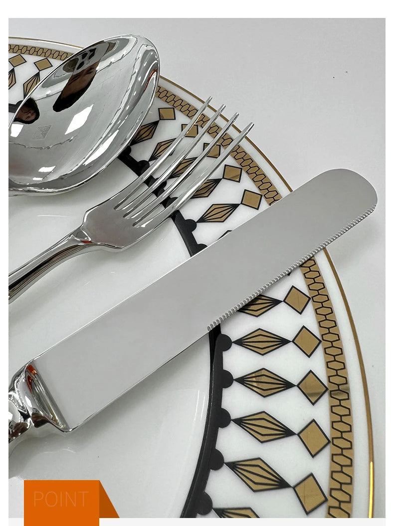 Stainless steel knife, fork, and spoon set by EcoNest Kitchen displayed on eco-conscious table setting