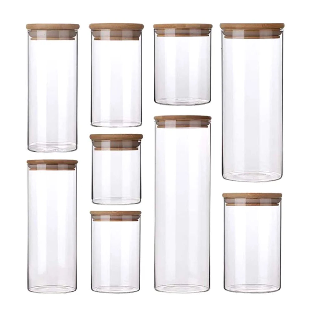 A collection of EcoNest Kitchen glass canisters with wooden lids, showcasing airtight seals for optimal food storage and organization.