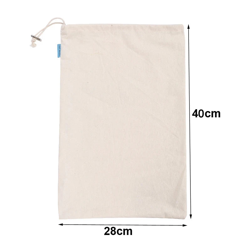 EcoNest reusable linen bread bag with drawstring, holding artisan bread on kitchen counter