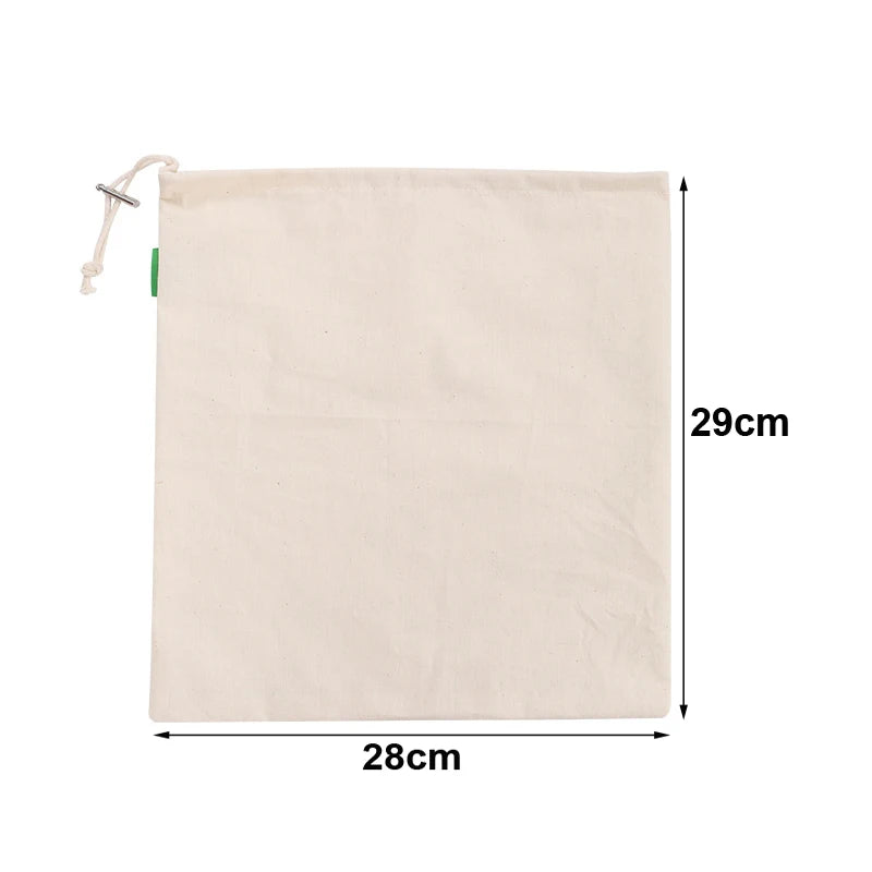 EcoNest reusable linen bread bag with drawstring, holding artisan bread on kitchen counter