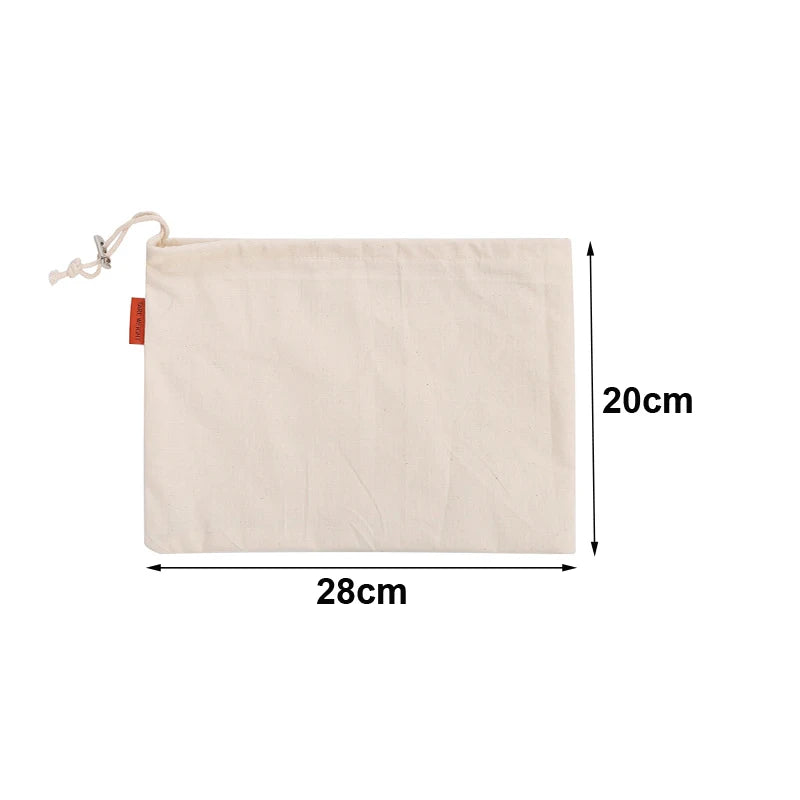EcoNest reusable linen bread bag with drawstring, holding artisan bread on kitchen counter