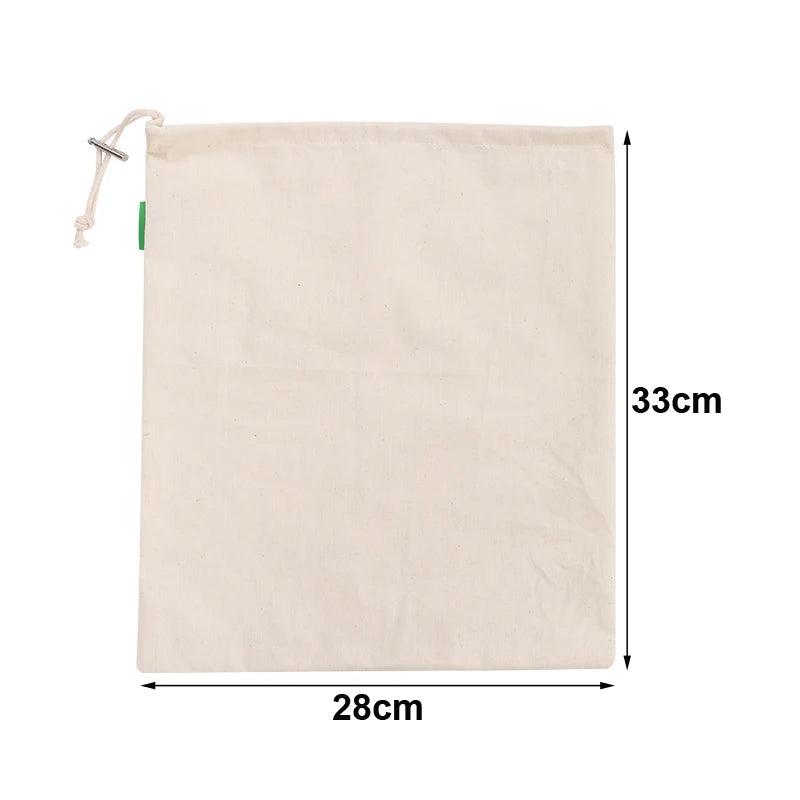 EcoNest reusable linen bread bag with drawstring, holding artisan bread on kitchen counter