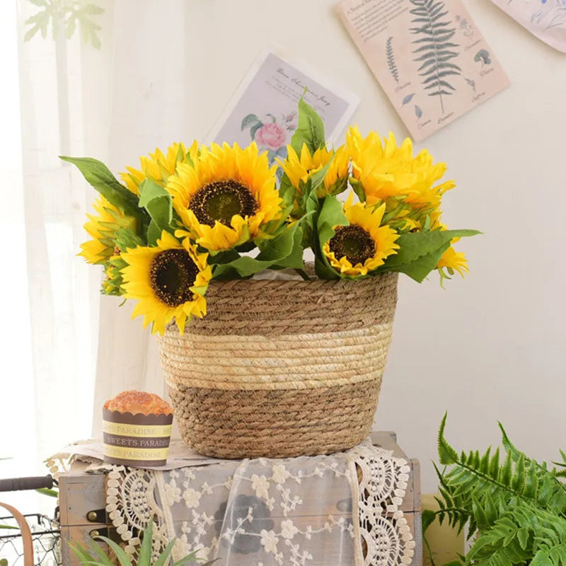 Sunflowers in a woven basket on a decorative surface with a light background