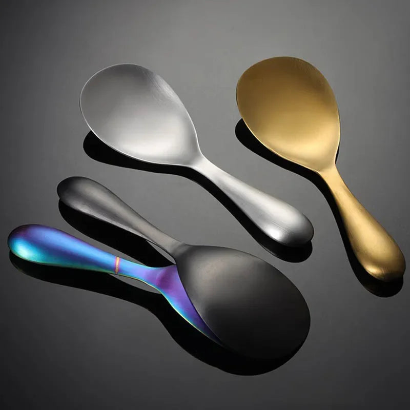Four spoons in different colors on a dark background
