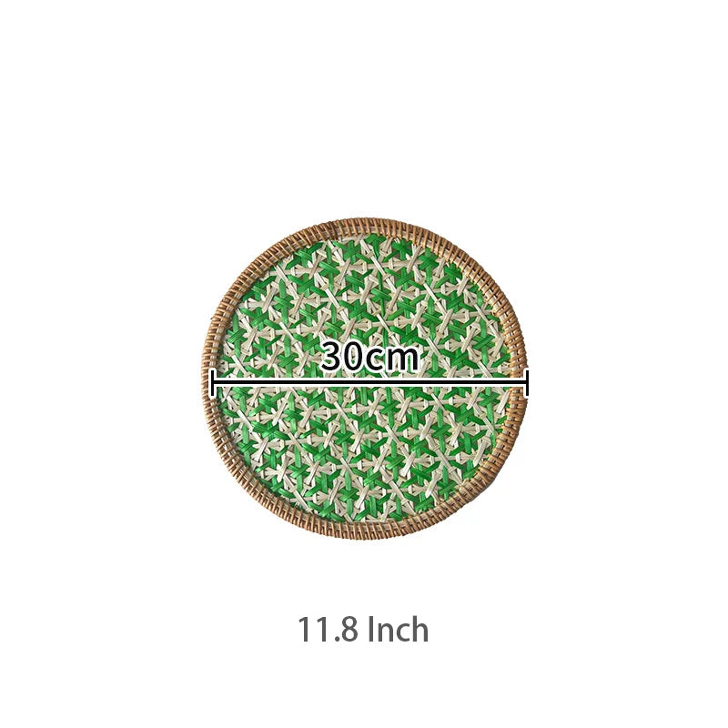 Round green and white patterned tray with measurement text on a white background
