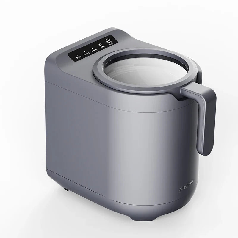 Envitek Recycle Food Machine in a modern kitchen setting, showcasing its sleek black design and stainless steel grinding chamber for effective food waste composting.