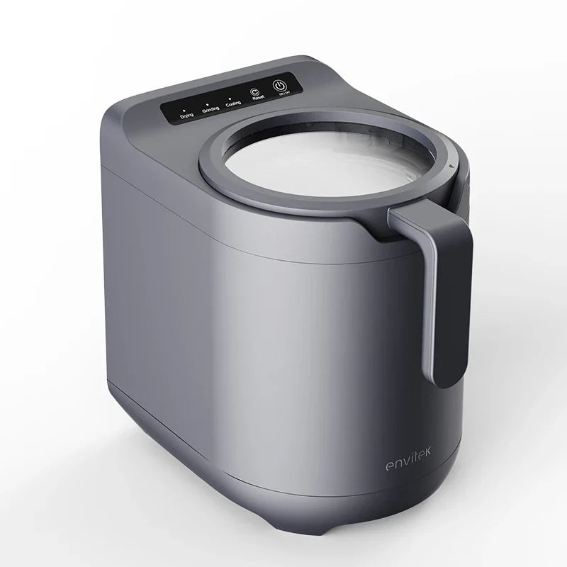 Envitek Recycle Food Machine in a modern kitchen setting, showcasing its sleek black design and stainless steel grinding chamber for effective food waste composting.