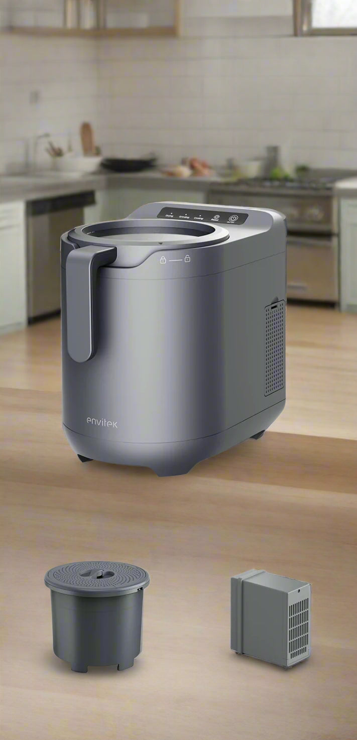 Envitek Recycle Food Machine in a modern kitchen setting, showcasing its sleek black design and stainless steel grinding chamber for effective food waste composting.