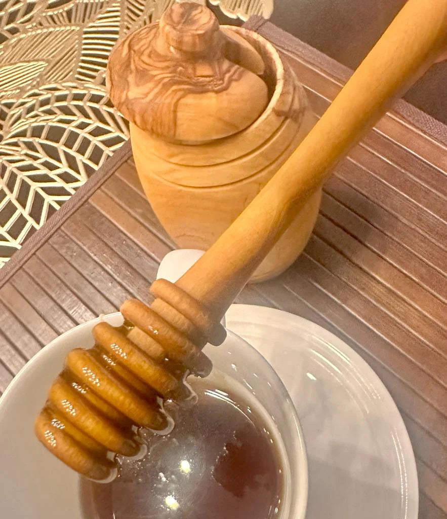 Elegant Olive Wood Honey Spoon, 6 inches long, smooth finish, eco-friendly, perfect for serving honey.