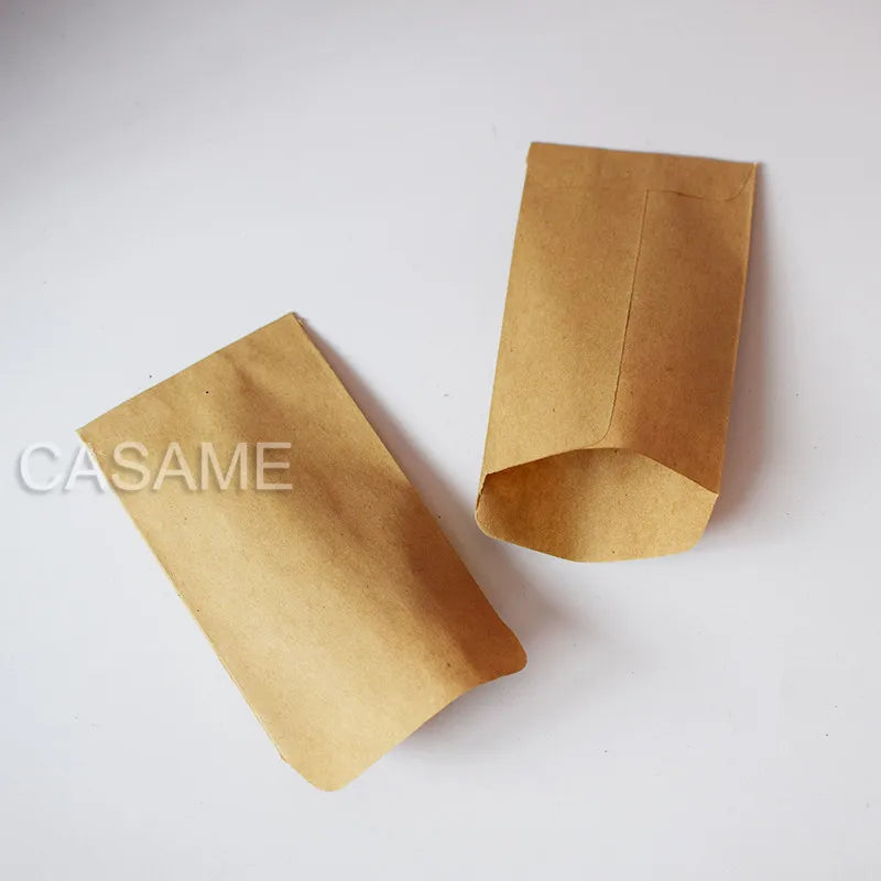 Two brown paper bags on a white background with 'CASAME' branding.