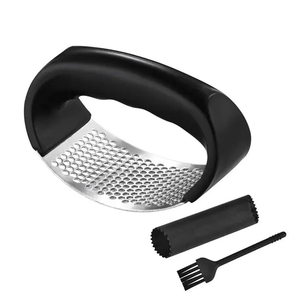 Black handheld grater with metal surface, brush, and cleaning tool on a white background