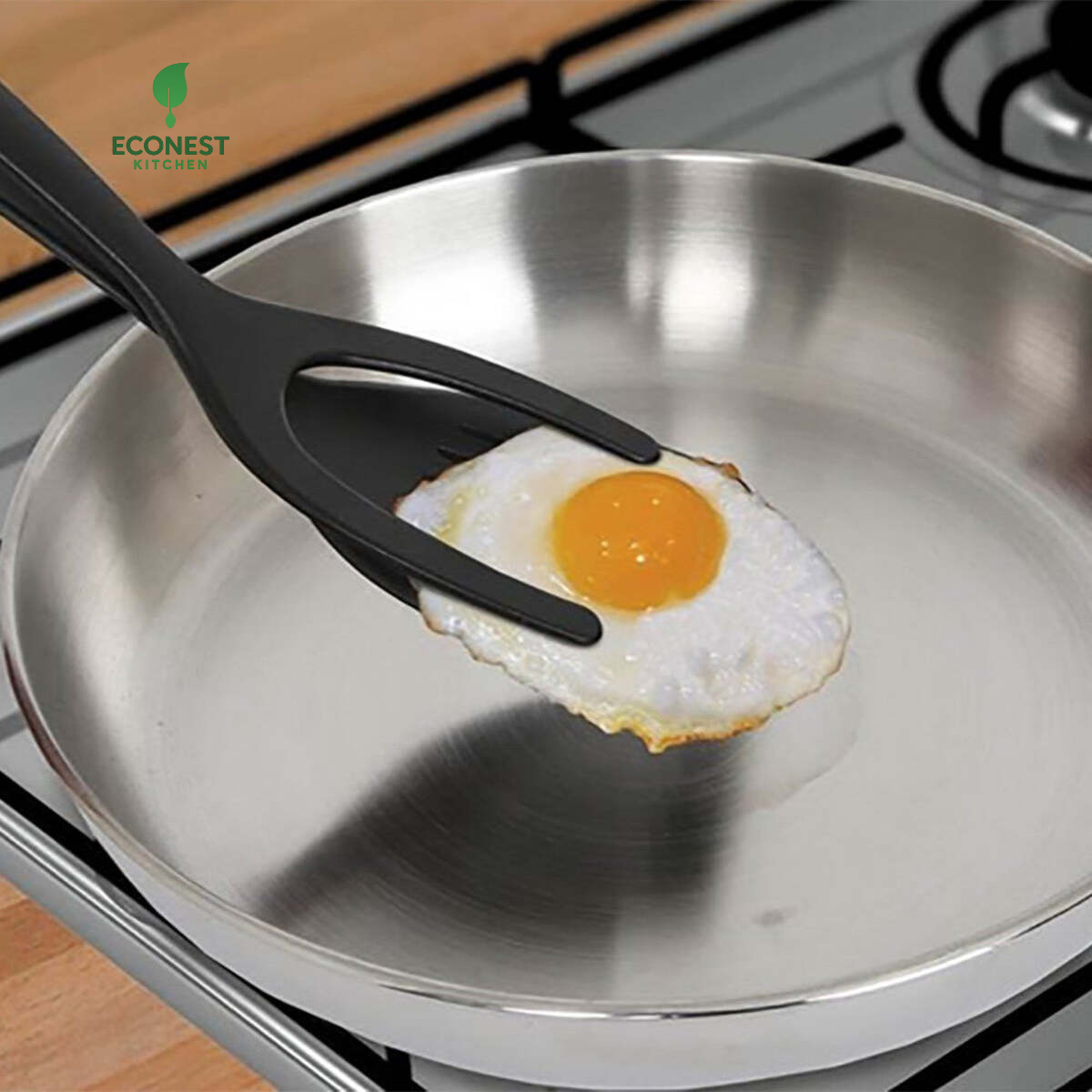 Egg on a pan with a spatula, Econest Kitchen logo visible