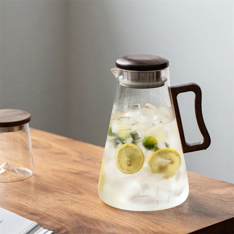 Large capacity 2000ML glass water jug with wooden handle and filter lid, heat-resistant and eco-friendly for hot or cold drinks.