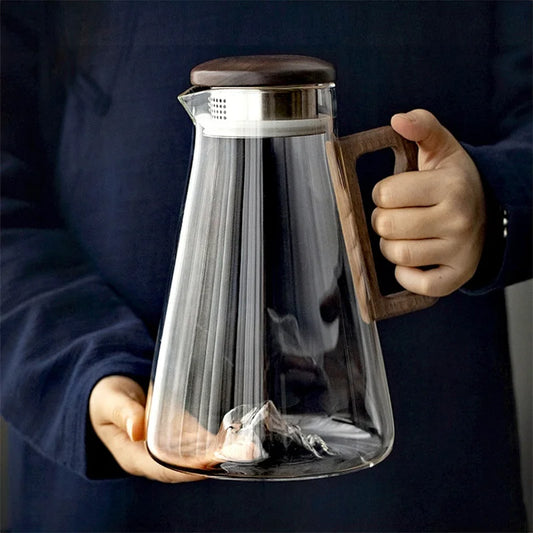 Large capacity 2000ML glass water jug with wooden handle and filter lid, heat-resistant and eco-friendly for hot or cold drinks.