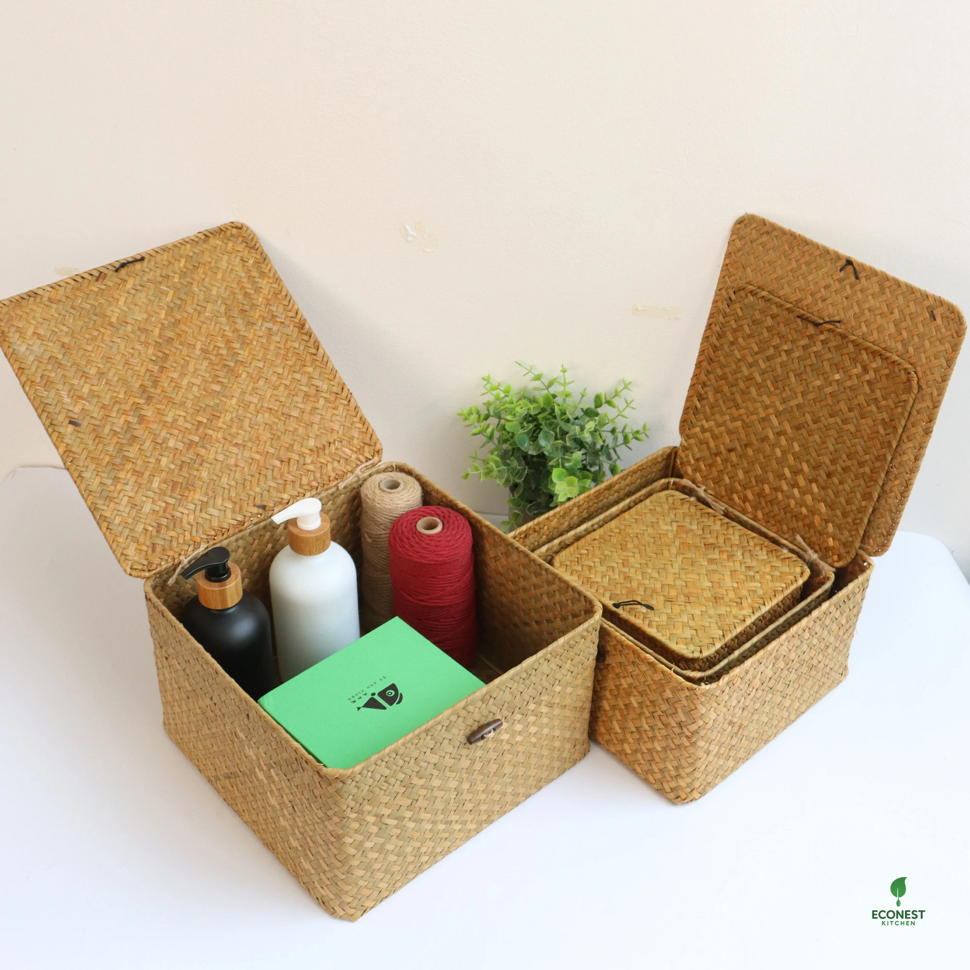 Woven storage baskets with various items on a white surface