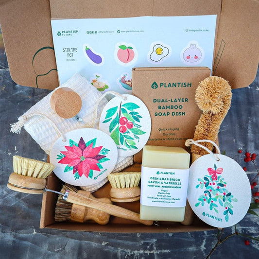 Plantish cleaning and grooming set with bamboo soap dish, scrubber, and soap bars on a gray surface.