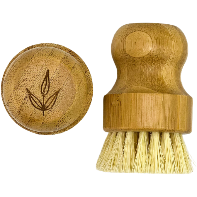 Close-up of bamboo pot brush with natural sisal bristles and engraved wooden lid - eco-friendly dish scrubber product detail