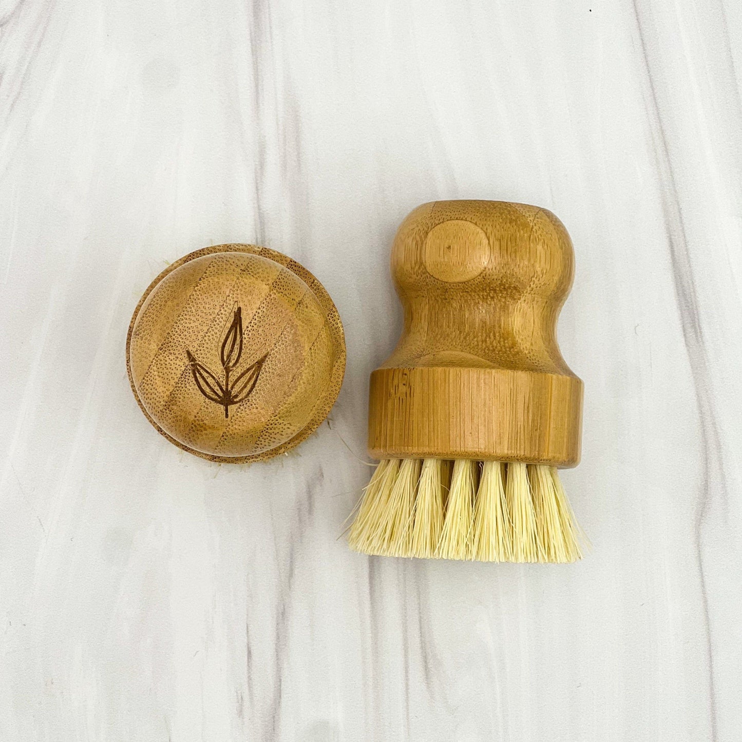 Bamboo pot brush with natural sisal bristles and wooden lid - eco-friendly dish cleaning brush on white background