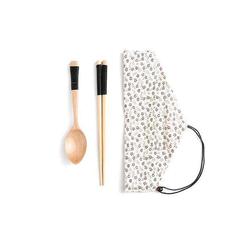 Eco-friendly bamboo travel cutlery set with reusable fork, spoon, and knife in a carrying pouch.