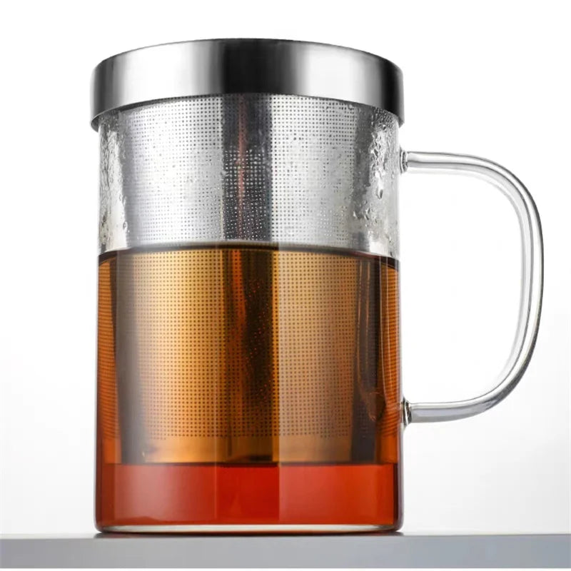High borosilicate glass travel mug with tea infuser, filter, and sturdy handgrip, ideal for hot and cold beverages.