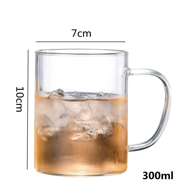 High borosilicate glass travel mug with tea infuser, filter, and sturdy handgrip, ideal for hot and cold beverages.
