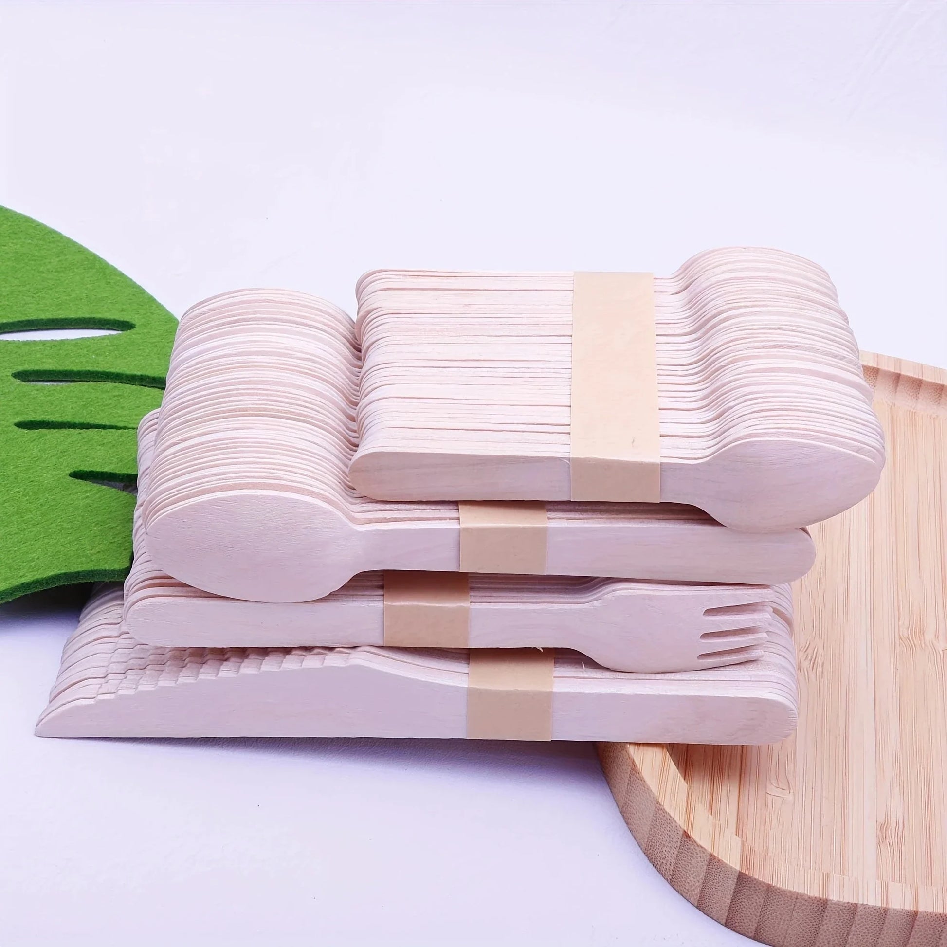 200 Pcs Party Disposable Wooden Tableware Set including forks, spoons, and teaspoons on a wooden table.