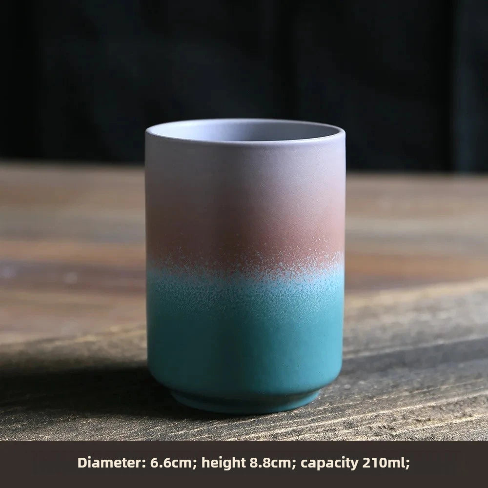 Ceramic cup with gradient color design on a wooden surface