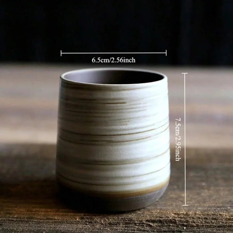 Ceramic cup with dimensions on a wooden surface