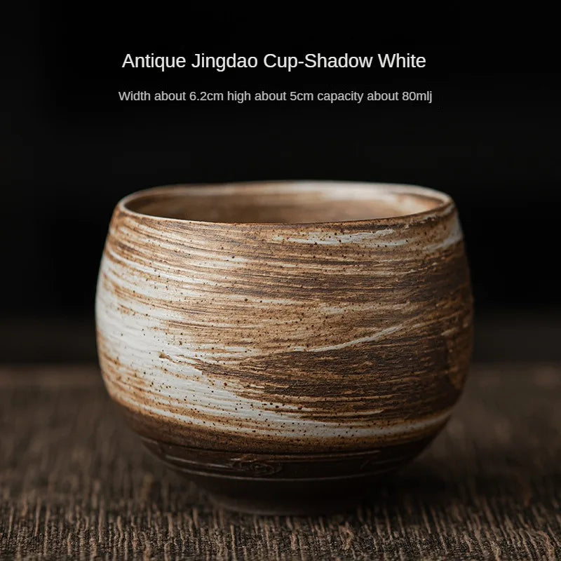 Ceramic cup with 'Antique Jingdao Cup-Shadow White' text on a dark background