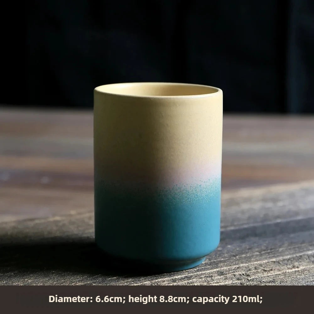 Ceramic cup with gradient color on a wooden surface