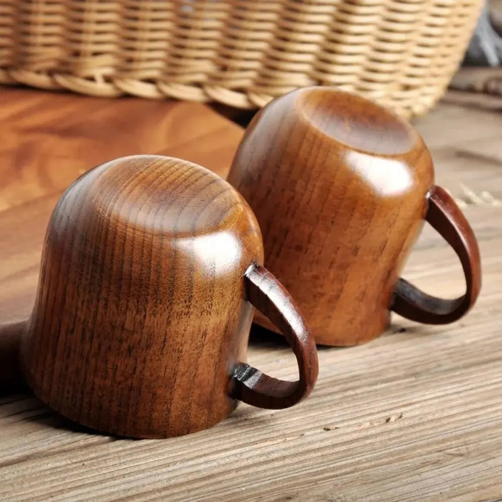 EcoNest 130ml Eco-Friendly Solid Wood Cup with Handle featuring tea inside on a rustic wooden table.