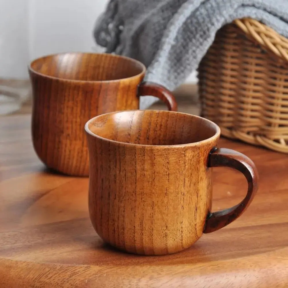 EcoNest 130ml Eco-Friendly Solid Wood Cup with Handle featuring tea inside on a rustic wooden table.