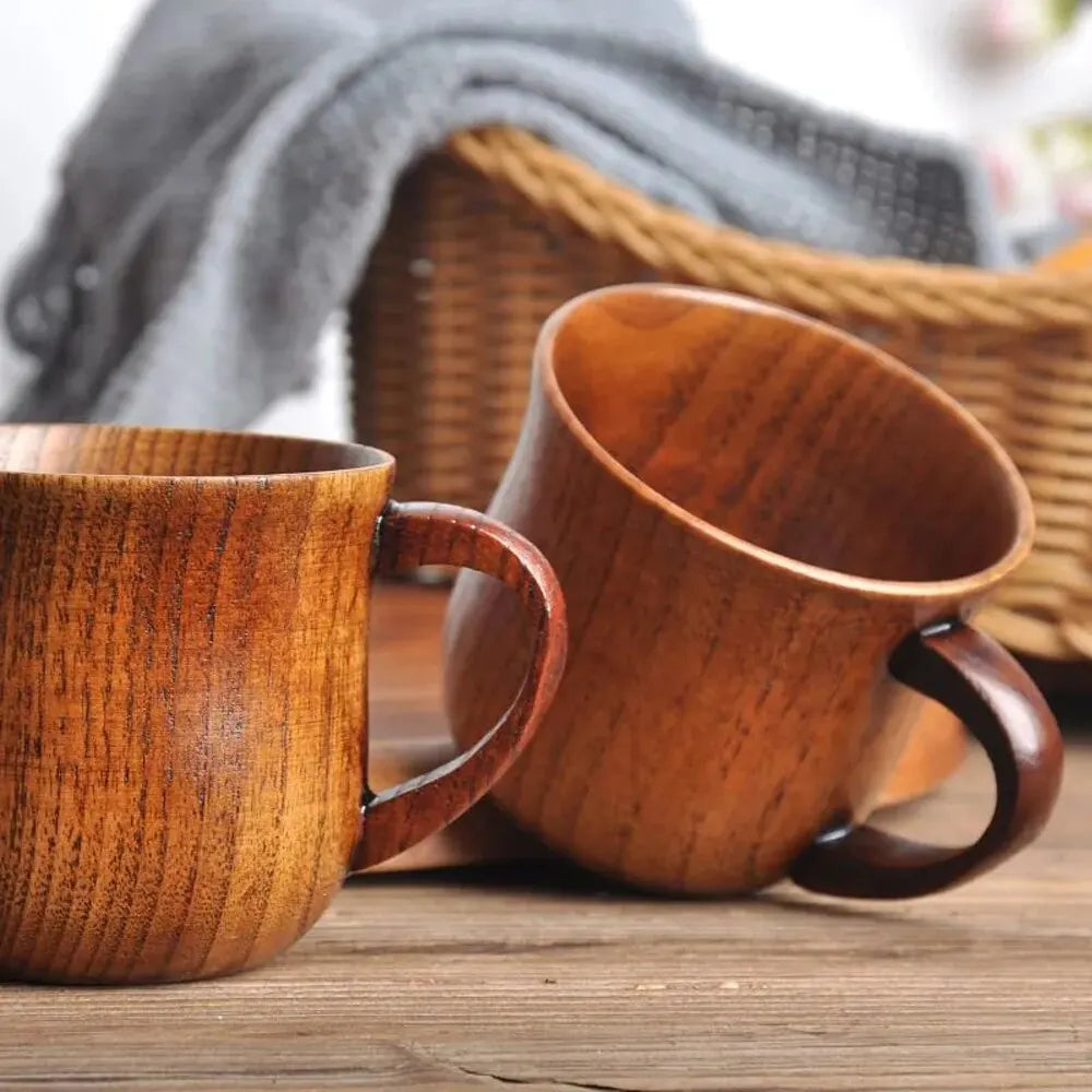 EcoNest 130ml Eco-Friendly Solid Wood Cup with Handle featuring tea inside on a rustic wooden table.