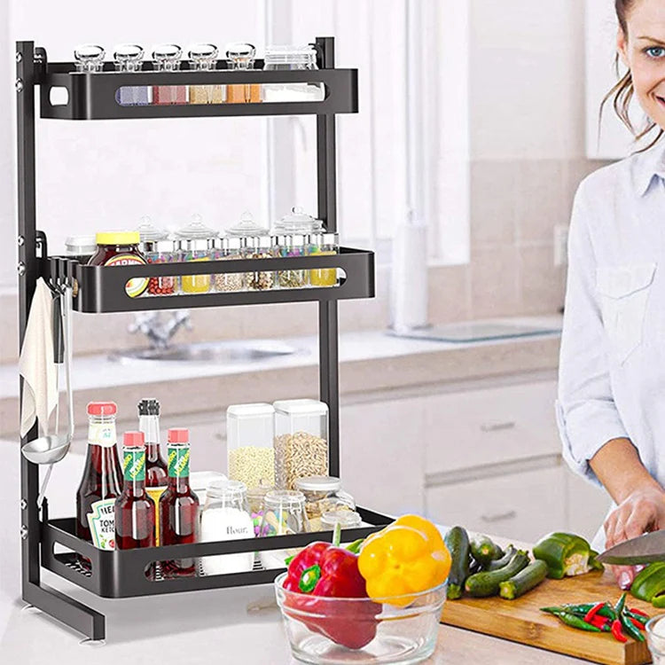 Black 3-tier expandable metal spice rack for kitchen storage and seasoning organization.