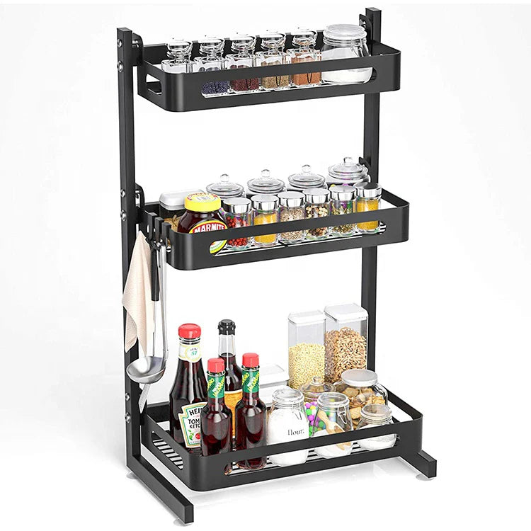 Black 3-tier expandable metal spice rack for kitchen storage and seasoning organization.