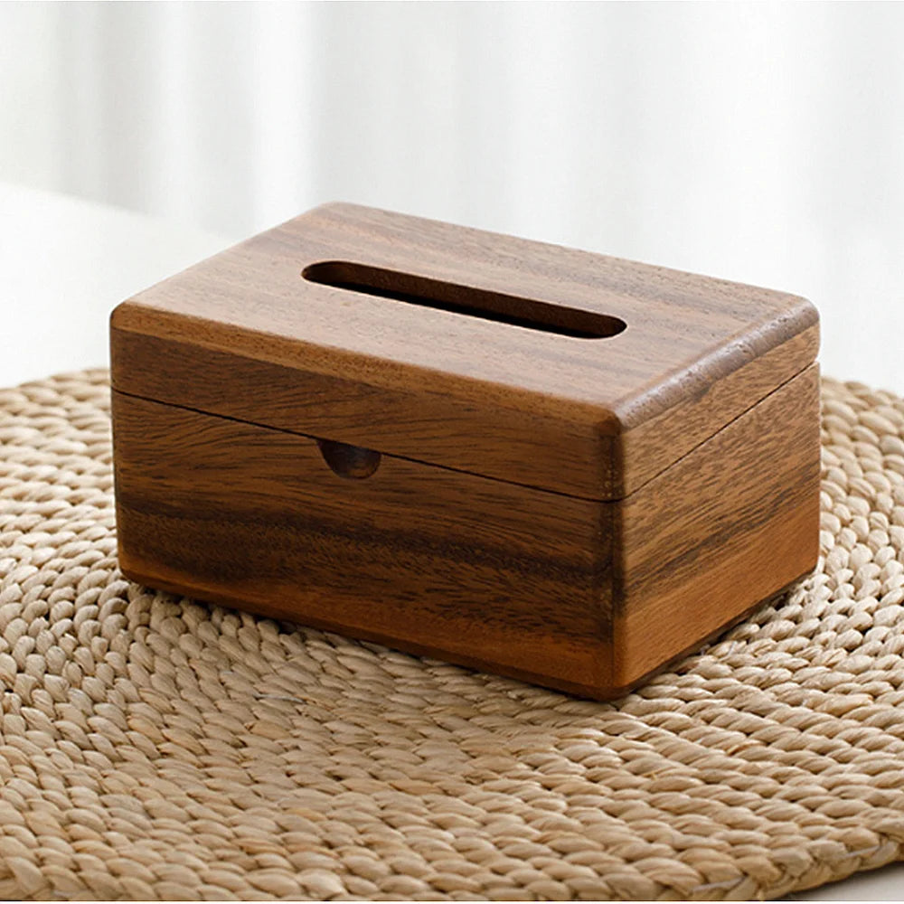 Wooden tissue box on a woven mat with a white background
