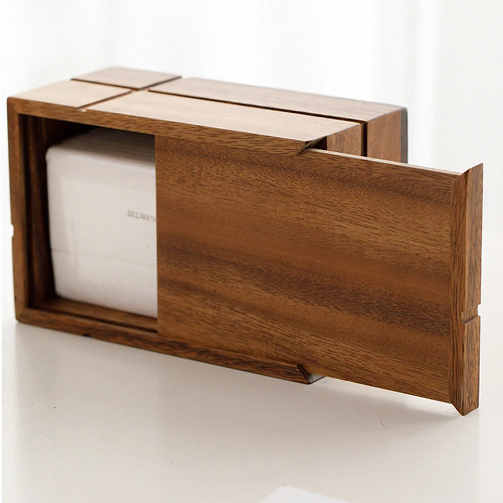 Wooden tissue holder with a white tissue roll inside on a white background