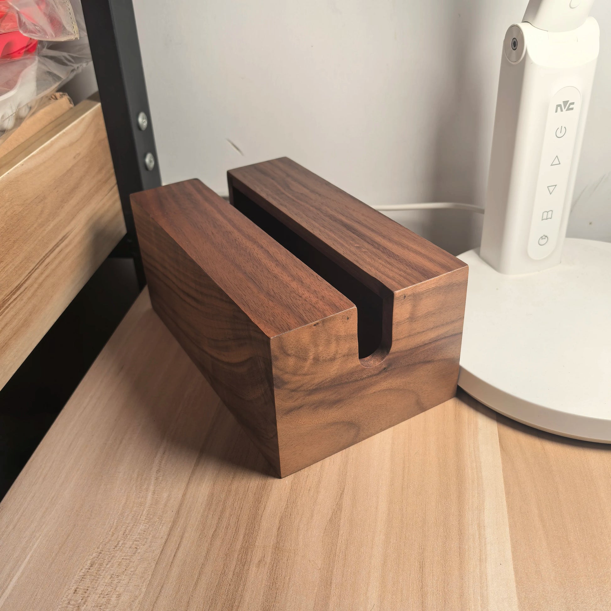 Wooden knife block on a kitchen counter with a white appliance in the background