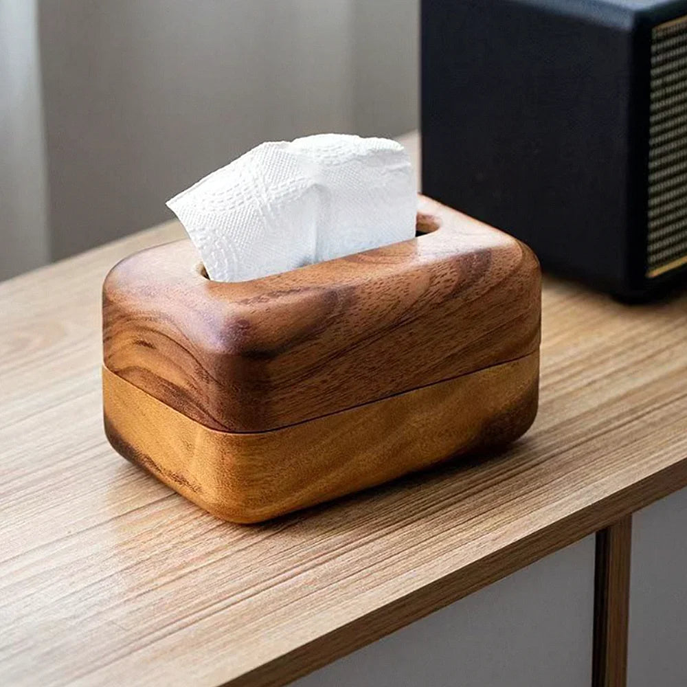 Wooden tissue box on a table with tissues peeking out