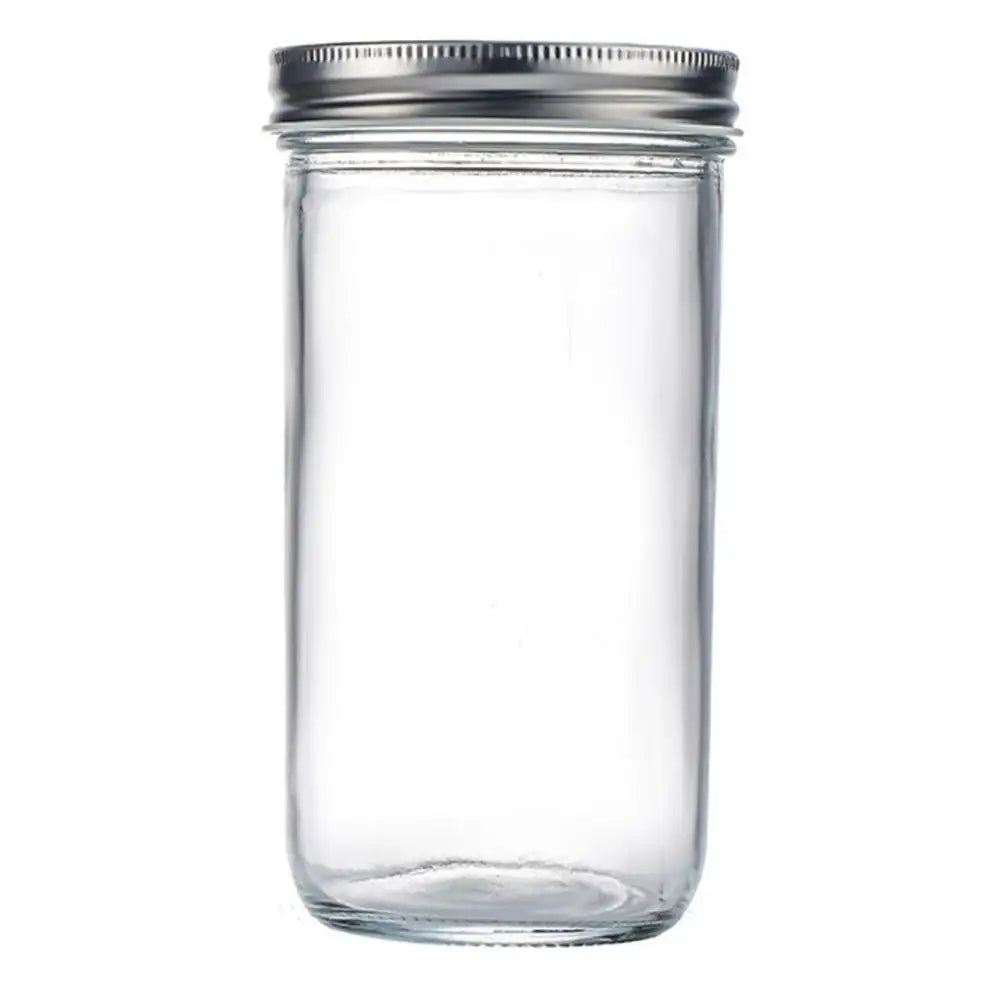 Clear glass jar with a metal lid on a white background