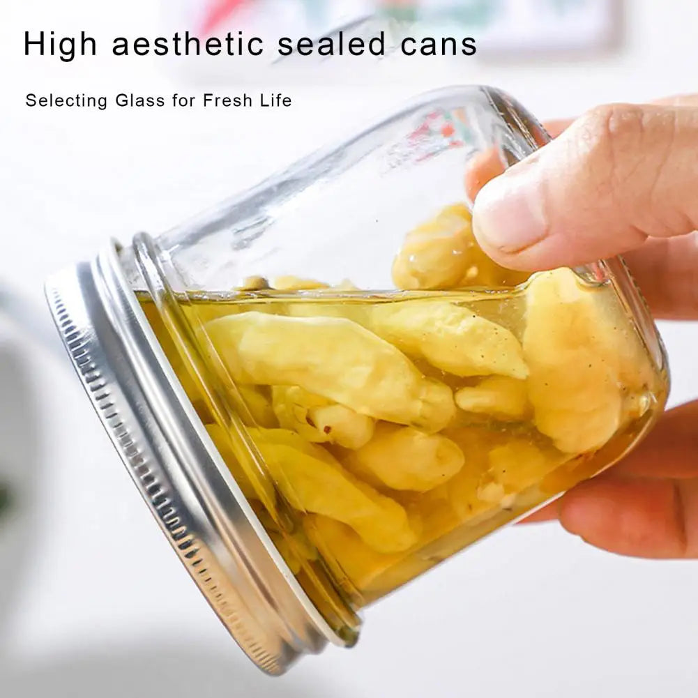Glass jar with preserved food, held by a hand, with text about high aesthetic sealed cans.