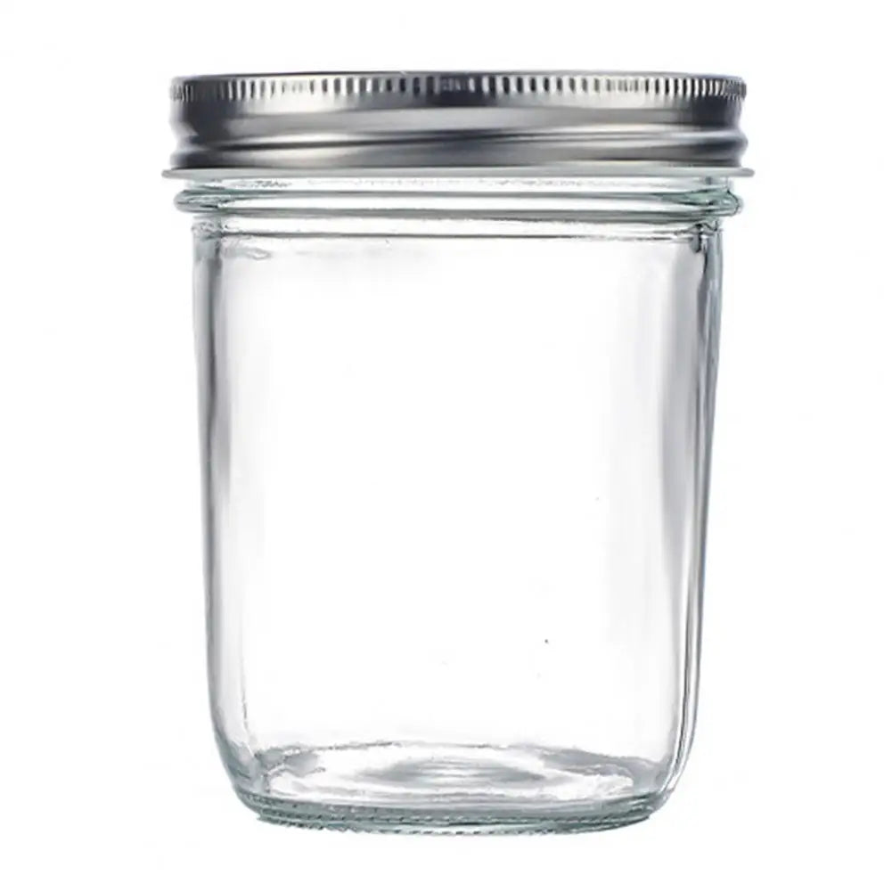 Clear glass jar with a metal lid on a white background