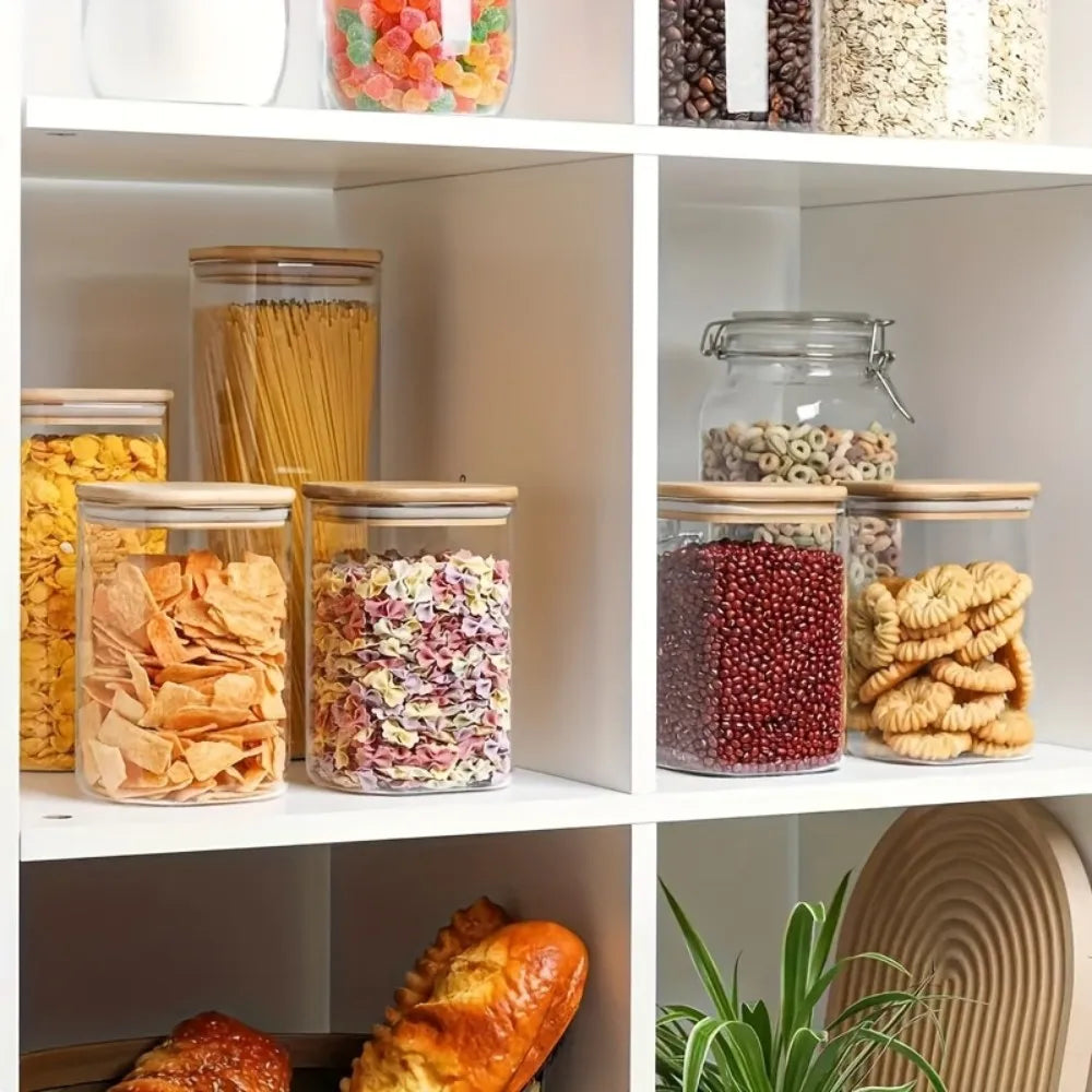 Stackable glass food storage jars with bamboo lids, sealed, transparent square containers for kitchen pantry and counter organization.