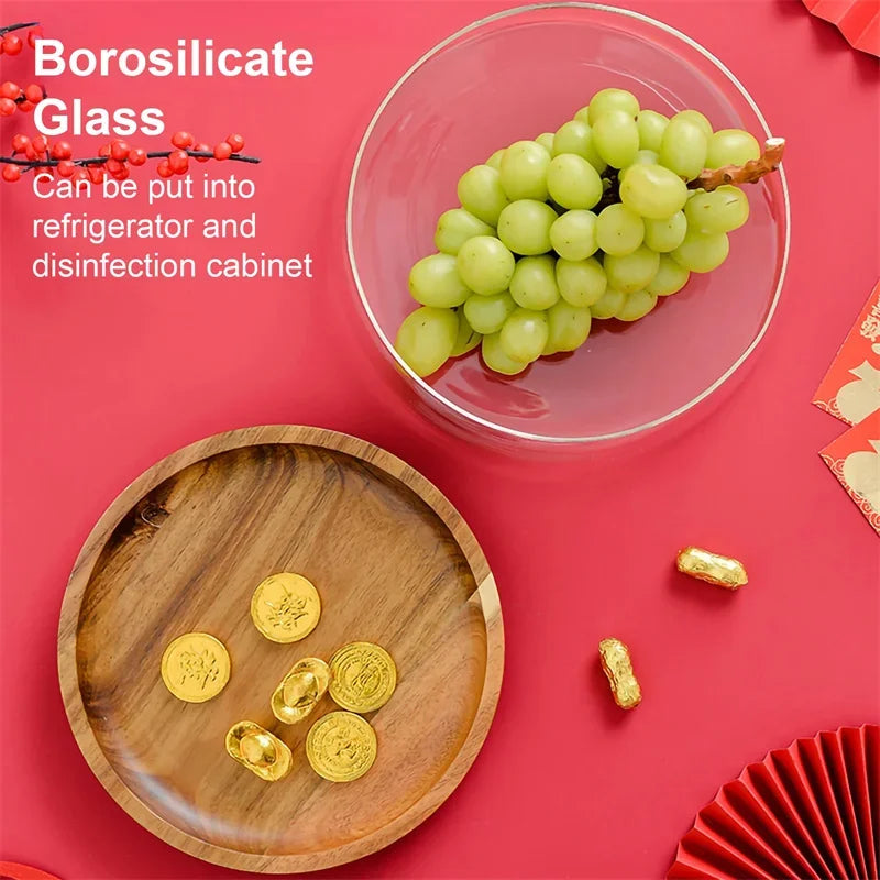 Glass bowl with grapes on a red background with text about borosilicate glass.
